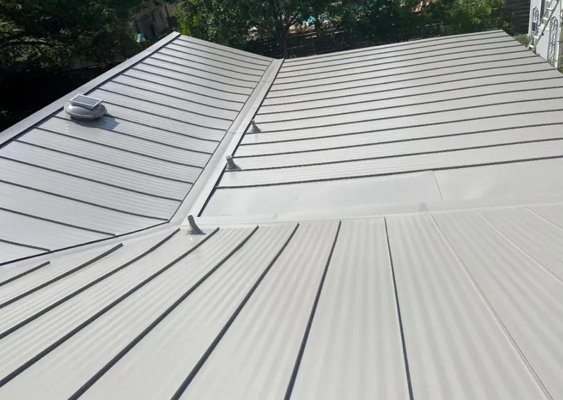 Solar attic fan installed on a metal roof for Roof Ventilation in Soquel